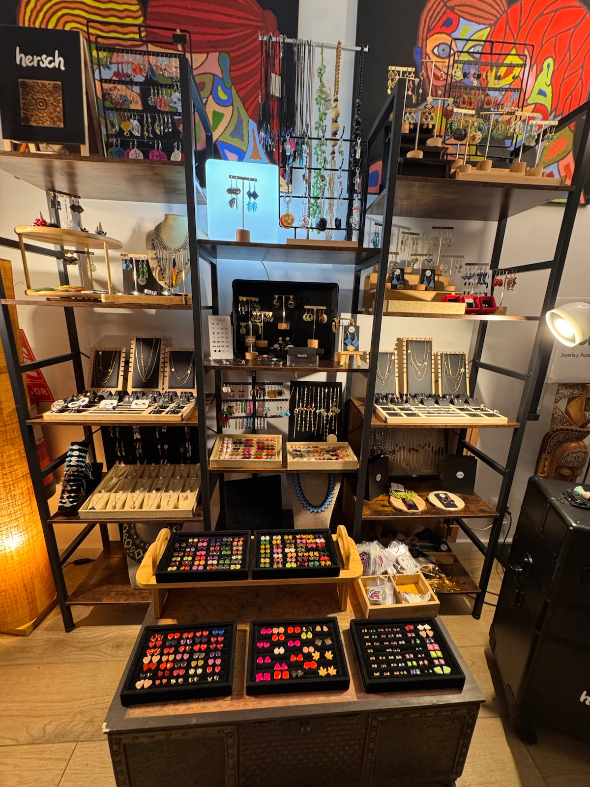 Hersch's signature dark metal and wood shelving at Ruzafa Creativa